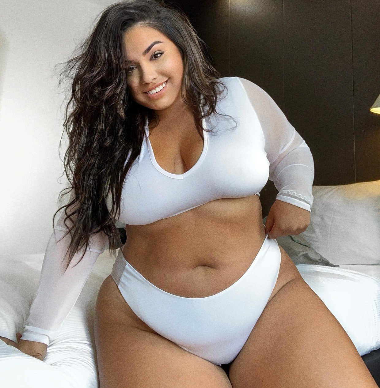 Curvy model gets wet and wild as she flaunts figure in nude